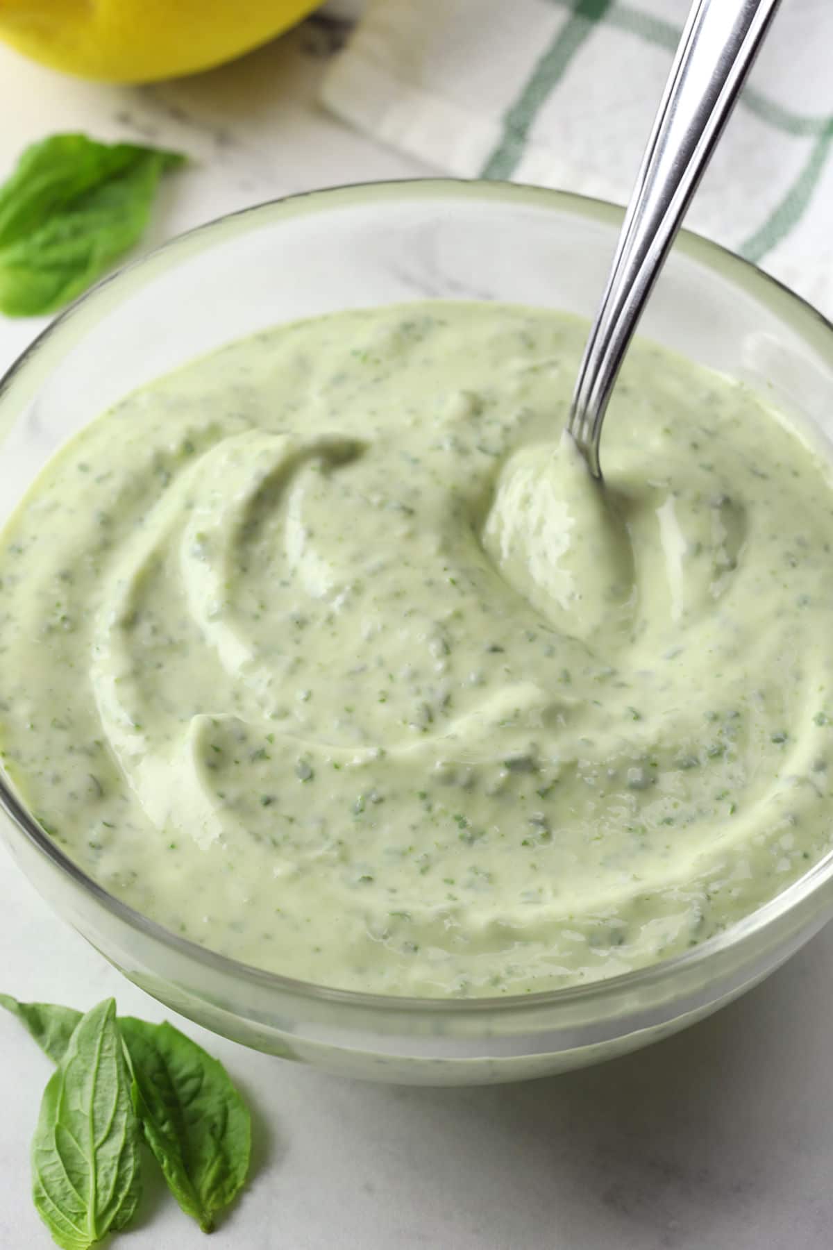 Close up of bowl full of basil aioli.