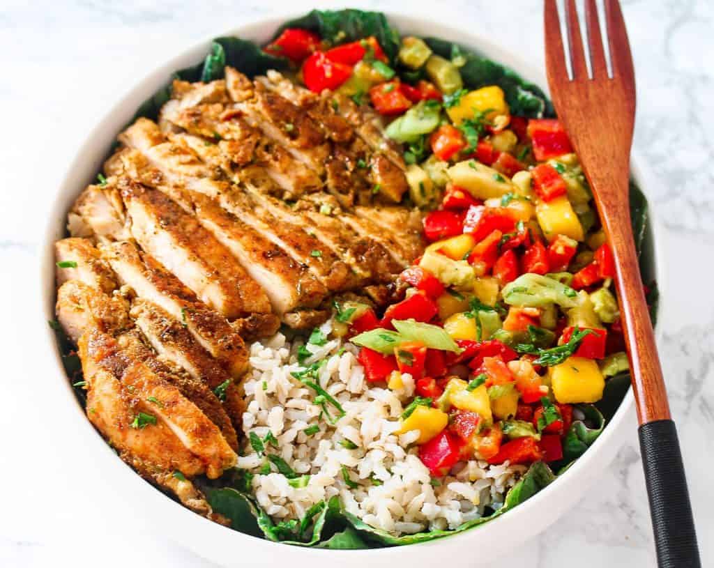 Chicken and mango salsa bowl with fork.