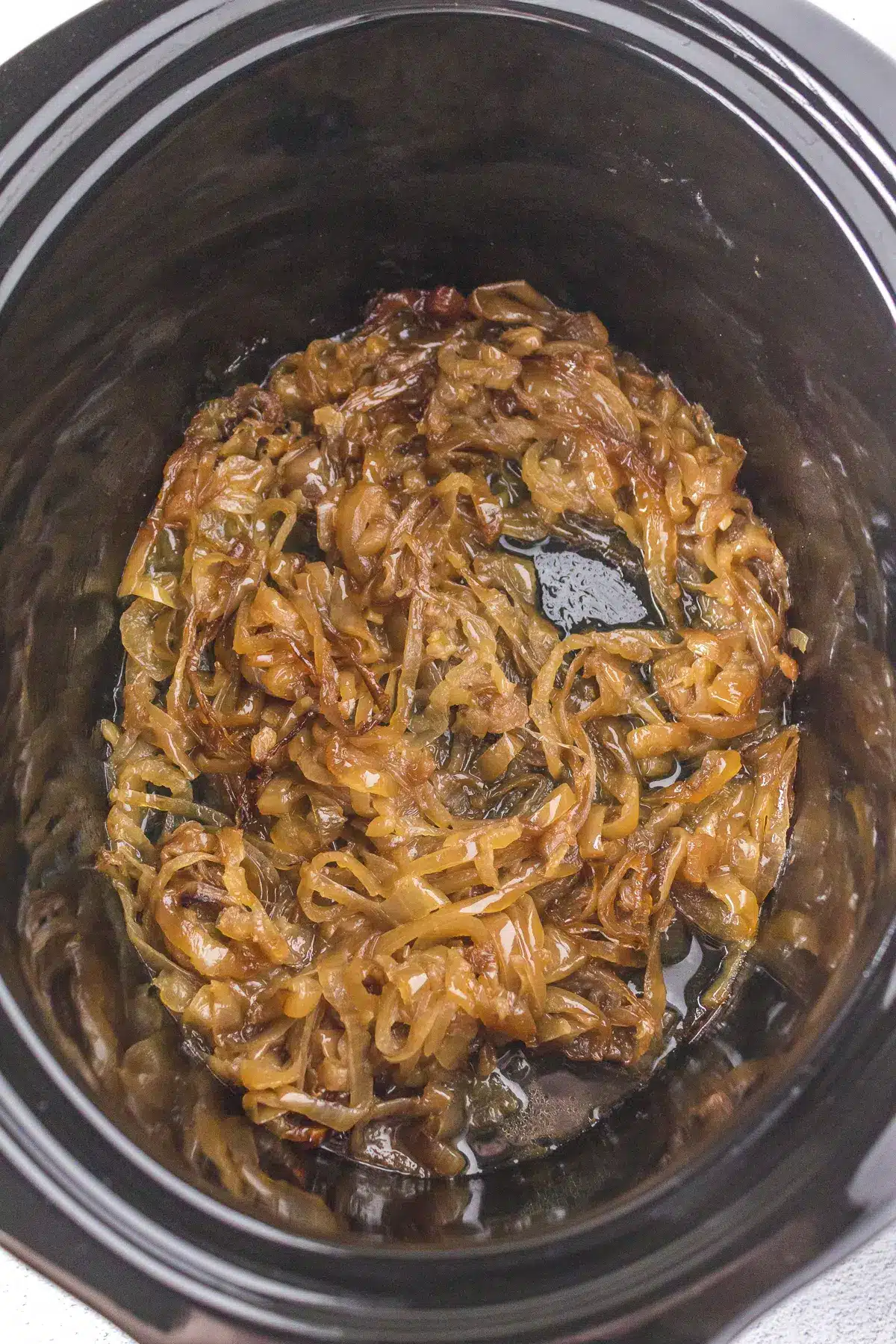 Slow cooker full of caramelized onions.