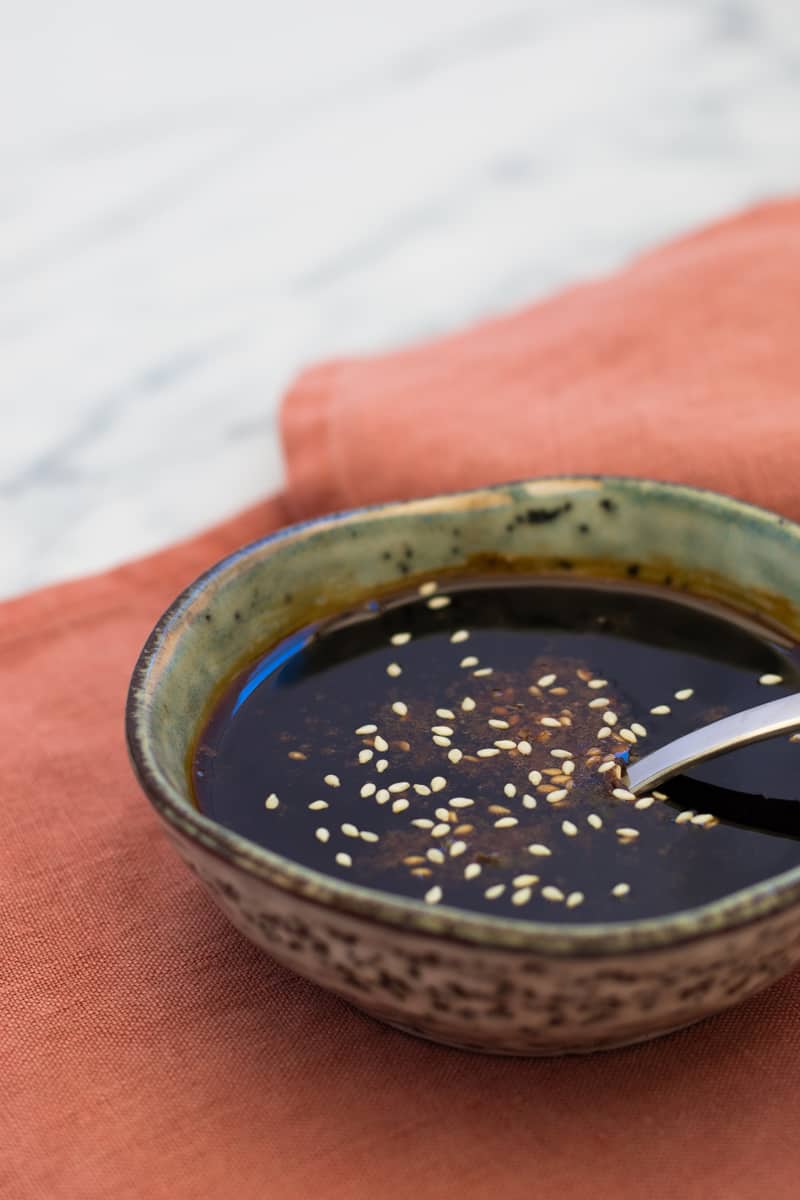 Teriyaki sauce in bowl with a spoon.