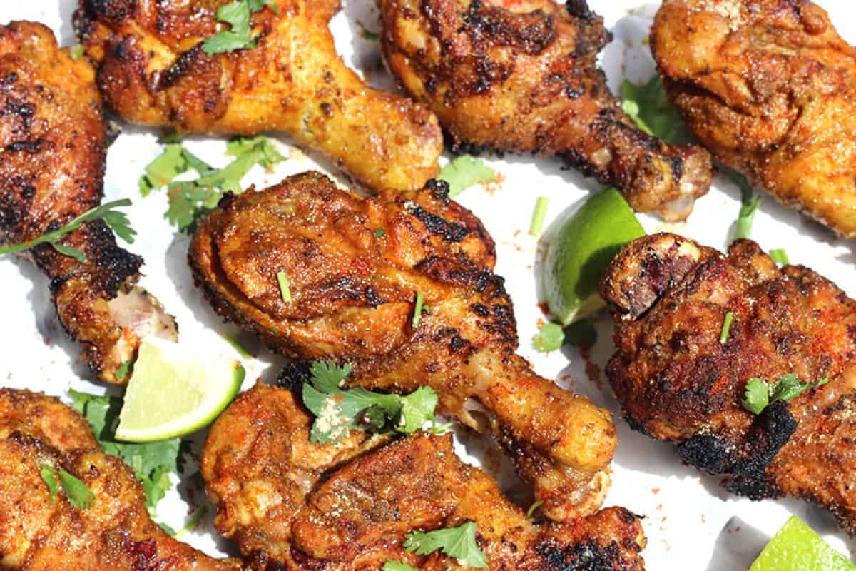 Tandoori grilled chicken legs with cilantro.