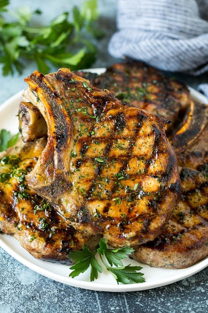 Plate with a stack of grilled pork chops.