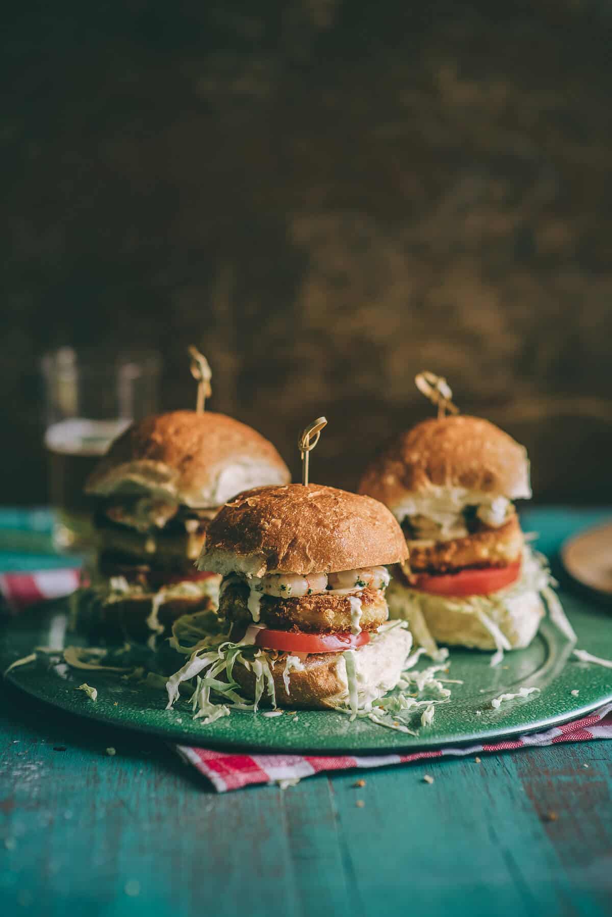 Breaded halloumi burgers with cabbage salad and aioli on a bun.