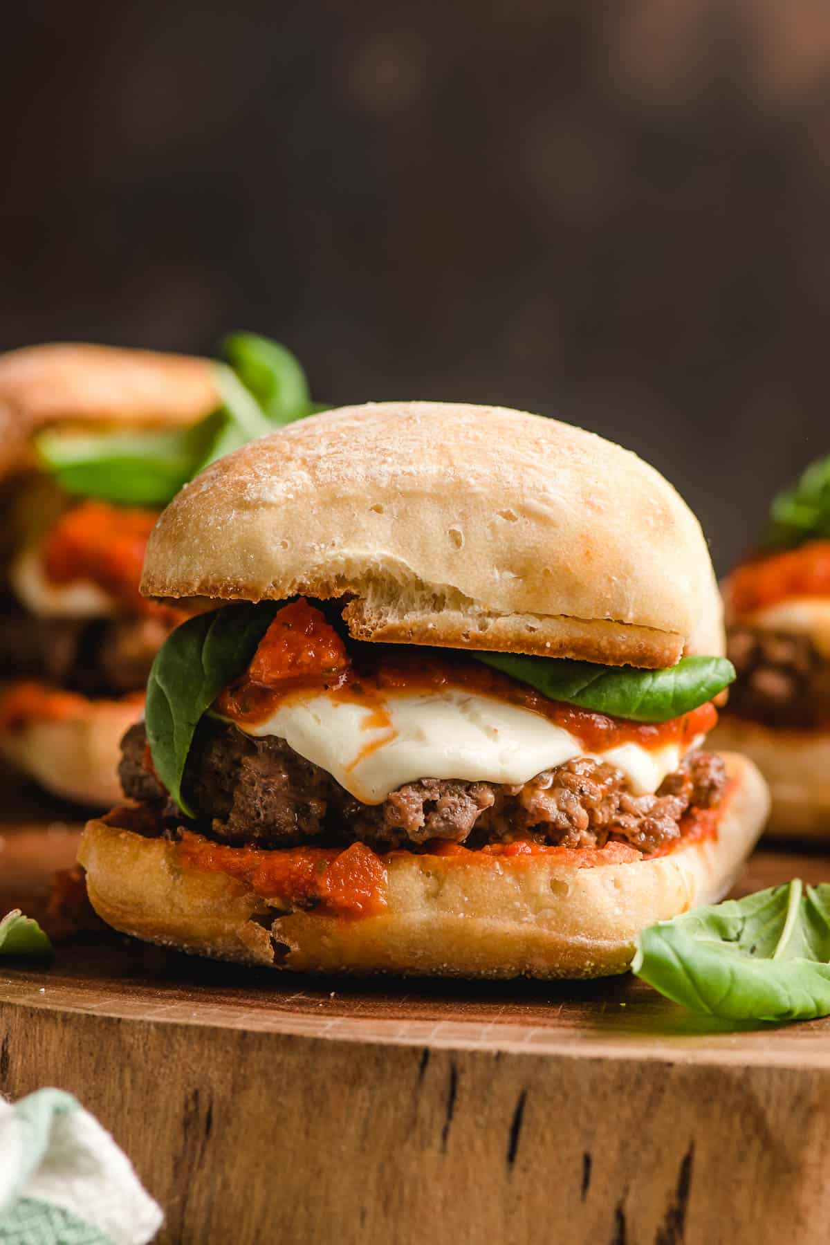 Italian burger with marinara and mozzarella on a ciabatta bun.