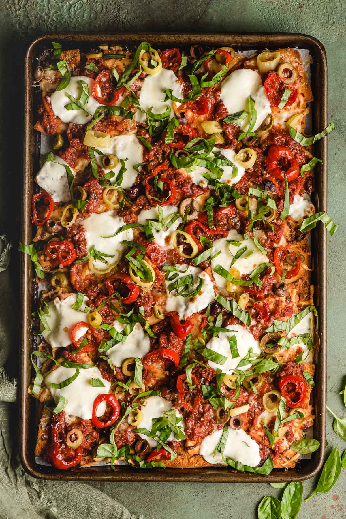 Sheet pan full of Italian nachos.