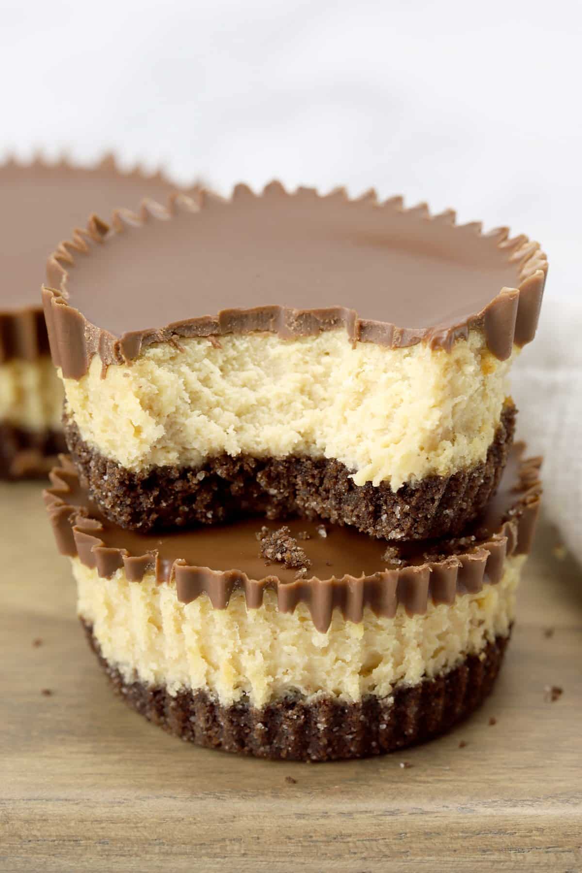 Stack of mini peanut butter cup cheesecakes.