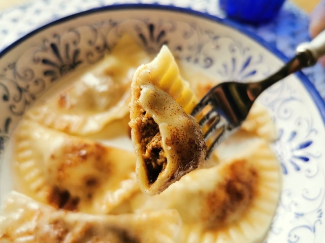 Fork holding sweet ravioli.