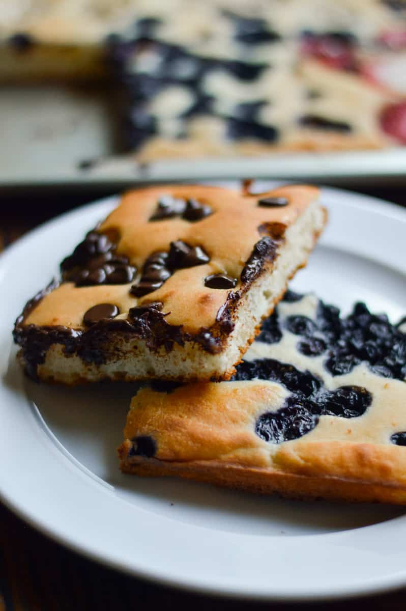 Square, sheet pan pancakes on a white plate.