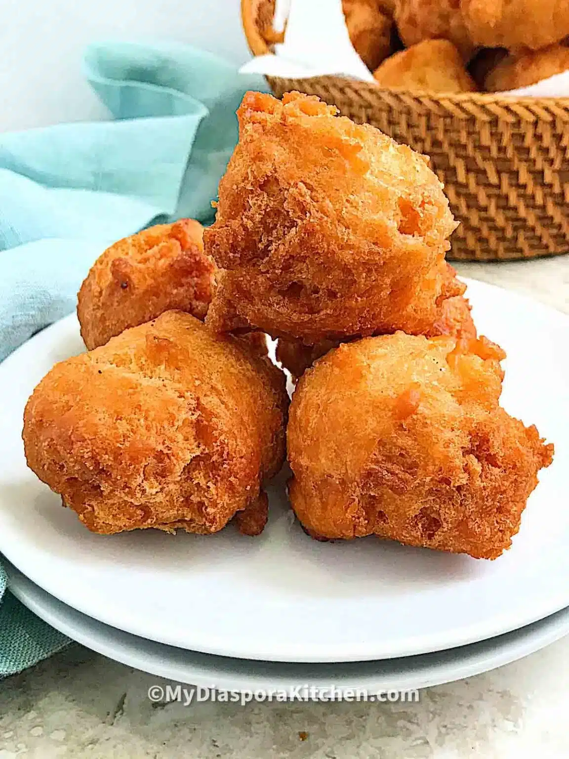 Nigerian donuts on a white plate.