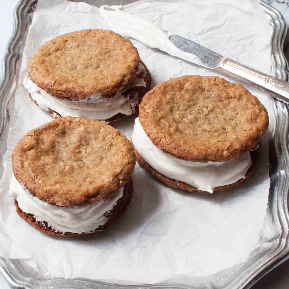 Amish oatmeal whoopie pies on a silver platter.