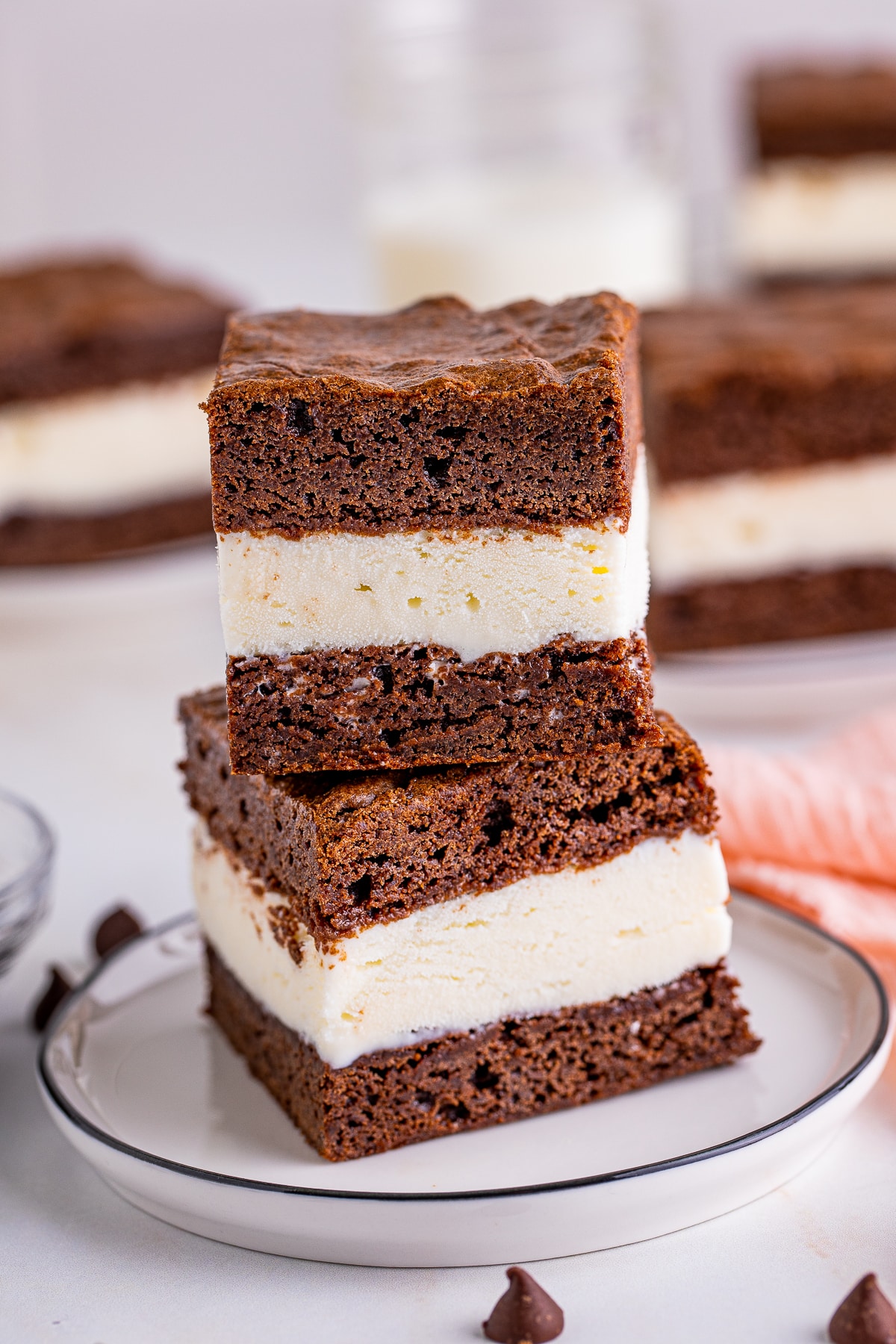 Brownie ice cream sandwiches on a white plate.