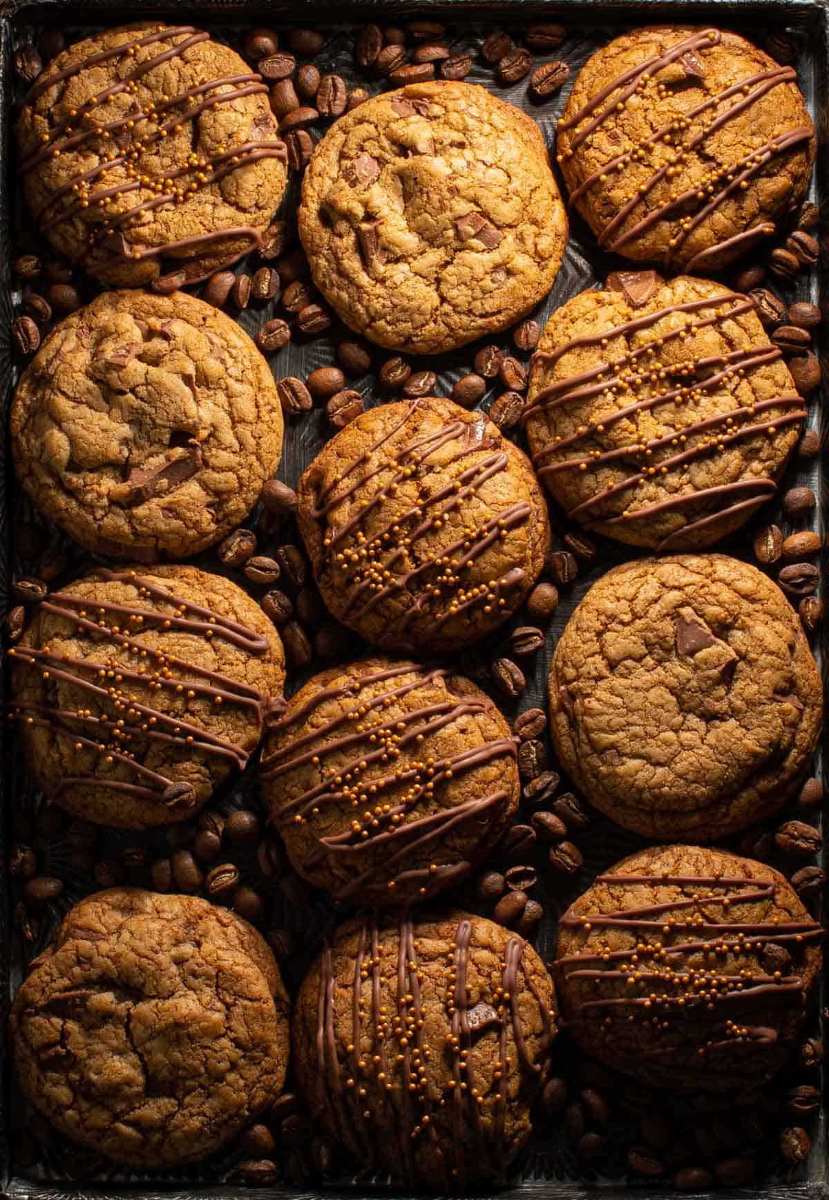 Decadent coffee cookies on a tray with coffee beans.