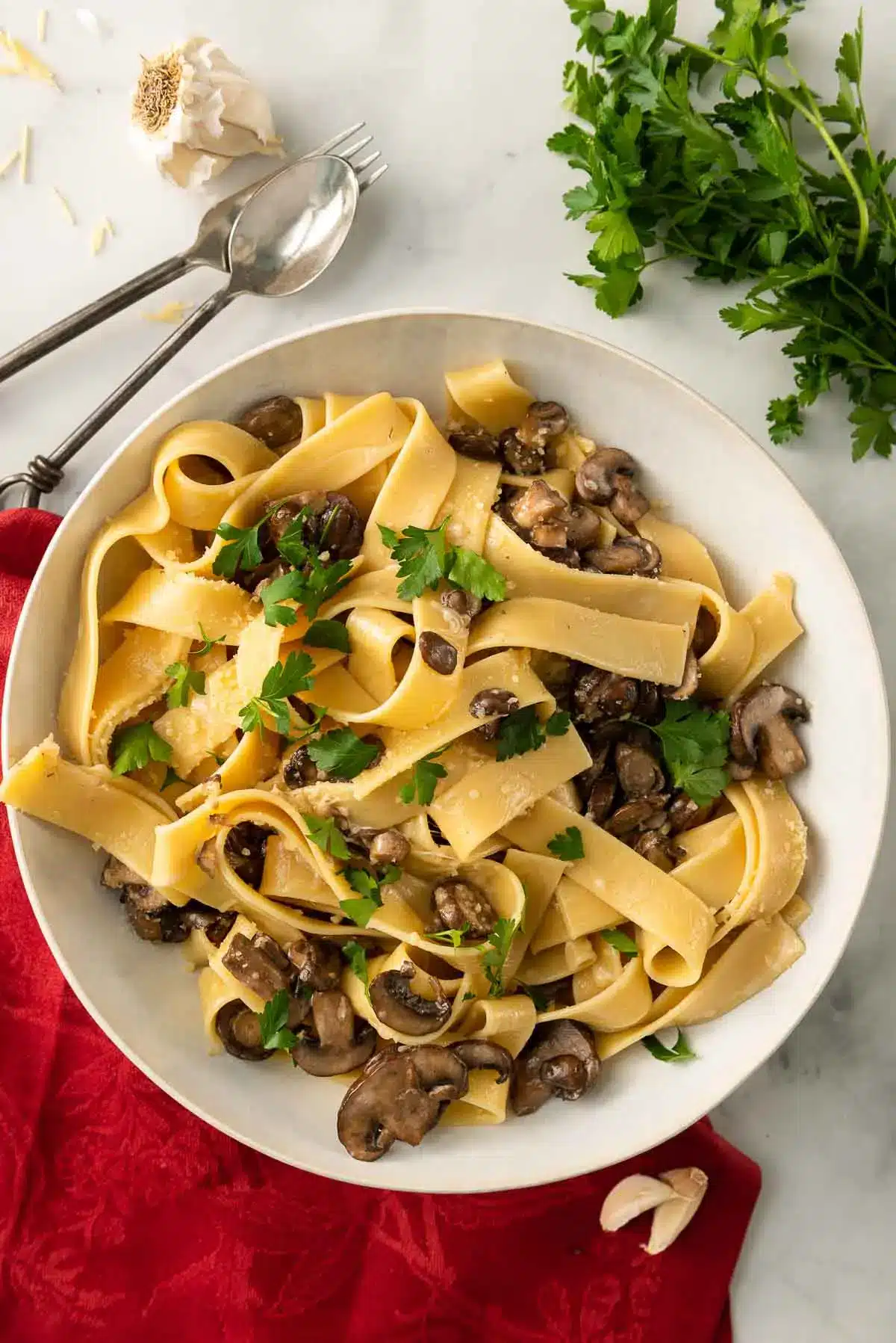 Creamy mushroom pappardelle on a light colored plate.