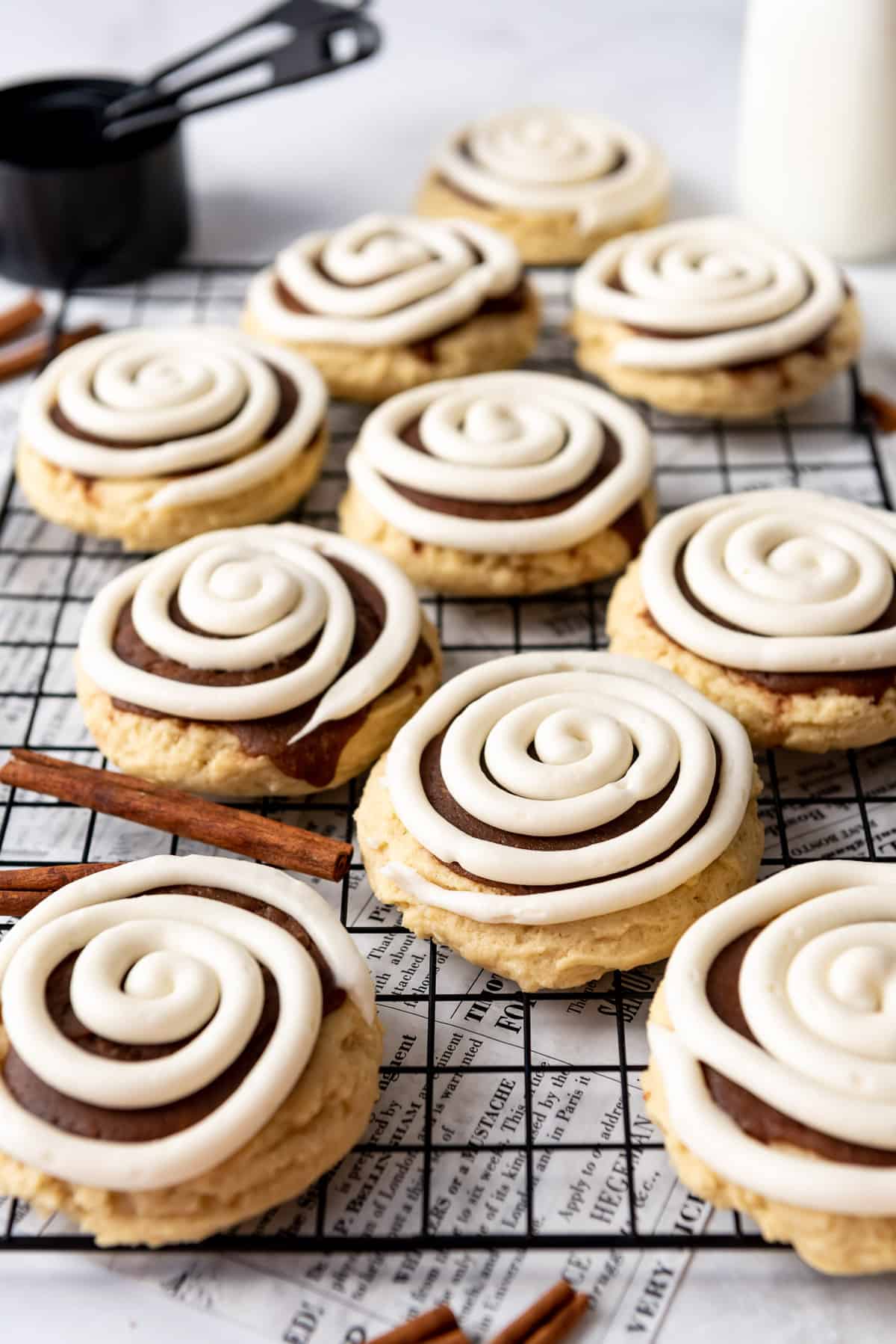 Cinnamon roll cookies on a cooling rack.