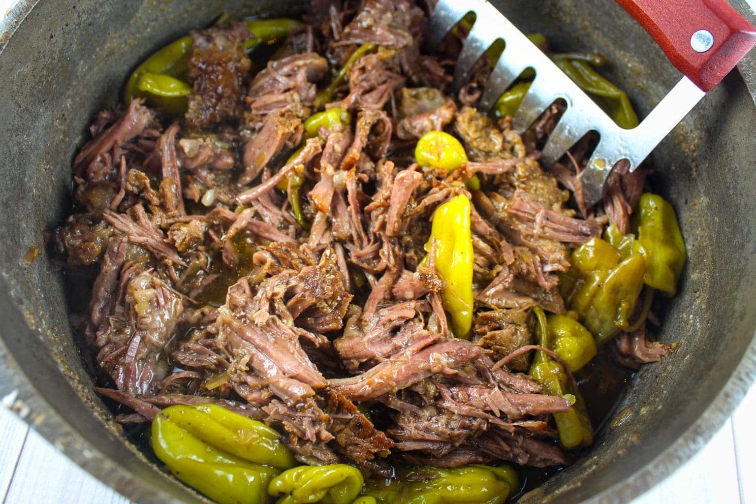 Dutch oven Italian beef in a pot.