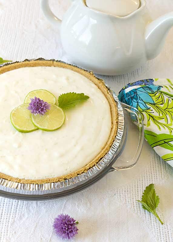 Key lime yogurt pie on a light colored background.