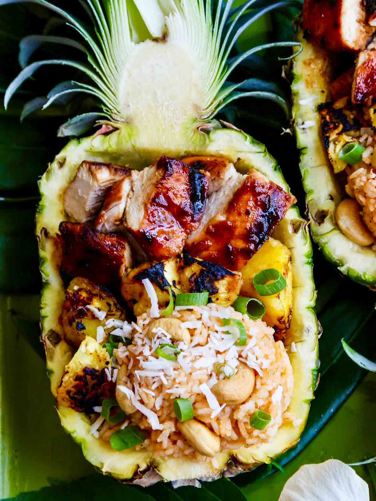 Huli huli chicken with coconut rice served in a pineapple.