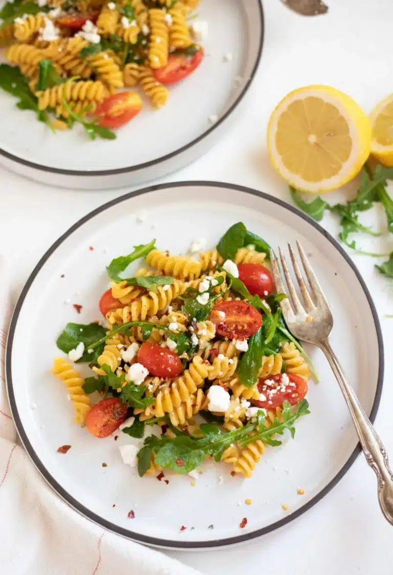 Rotini chickpea pasta on a white plate.