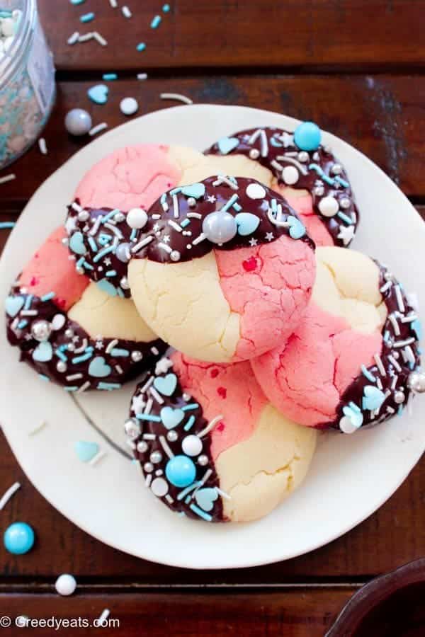 Neapolitan cookies on a white surface.