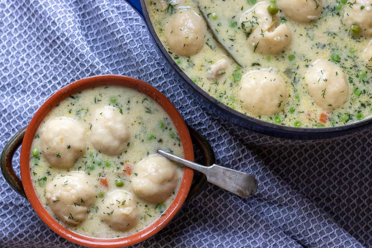 Chicken and dumplings in bowls.