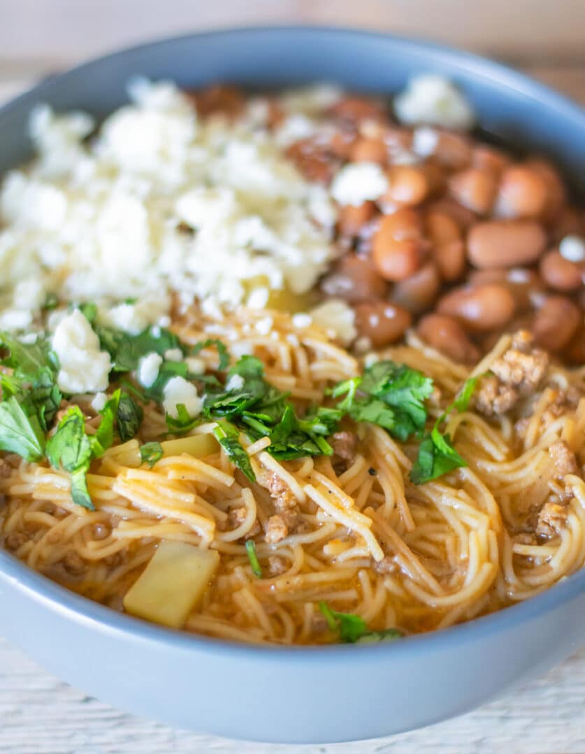 Mexican noodle recipes in a blue bowl.