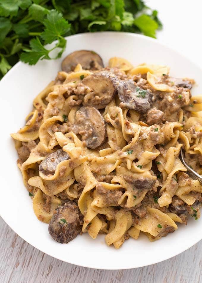 Instant pot hamburger stroganoff on a white plate.