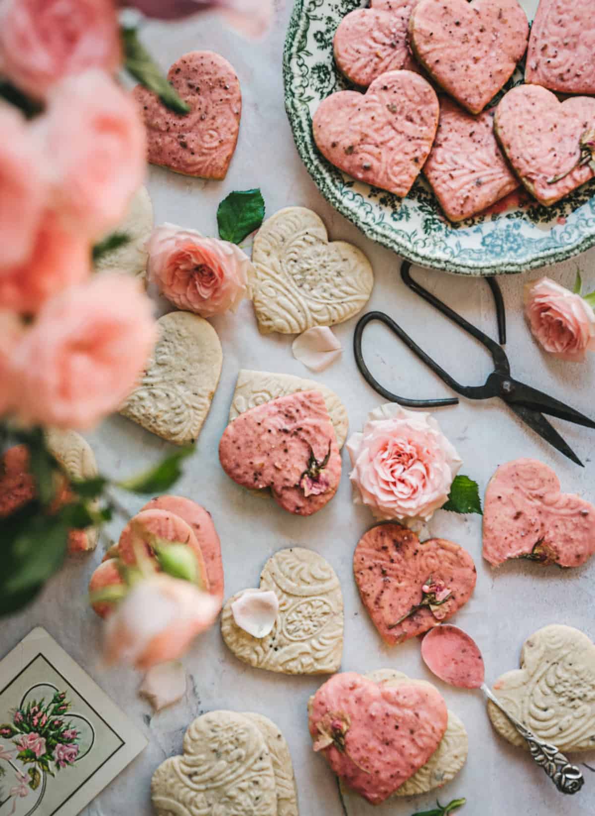 Rose cardamom shortbread cookies on a decorative plate.