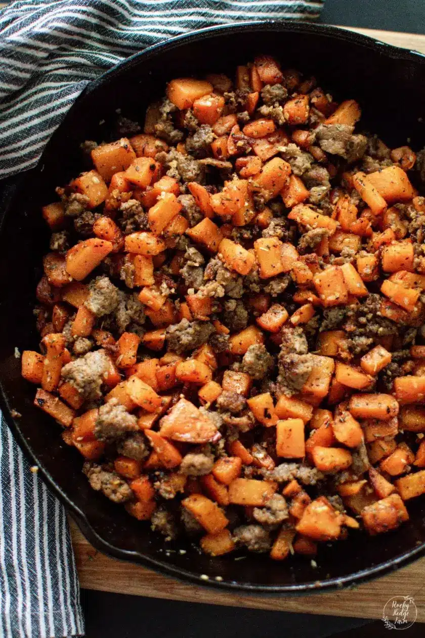 Sweet potato hash in a cast iron pan.