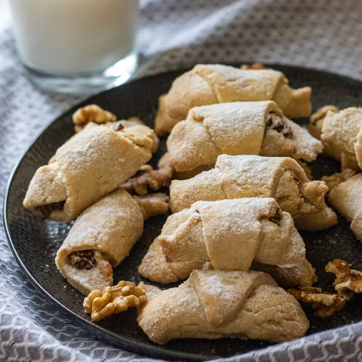 Turkish apple cookies on a black plate.