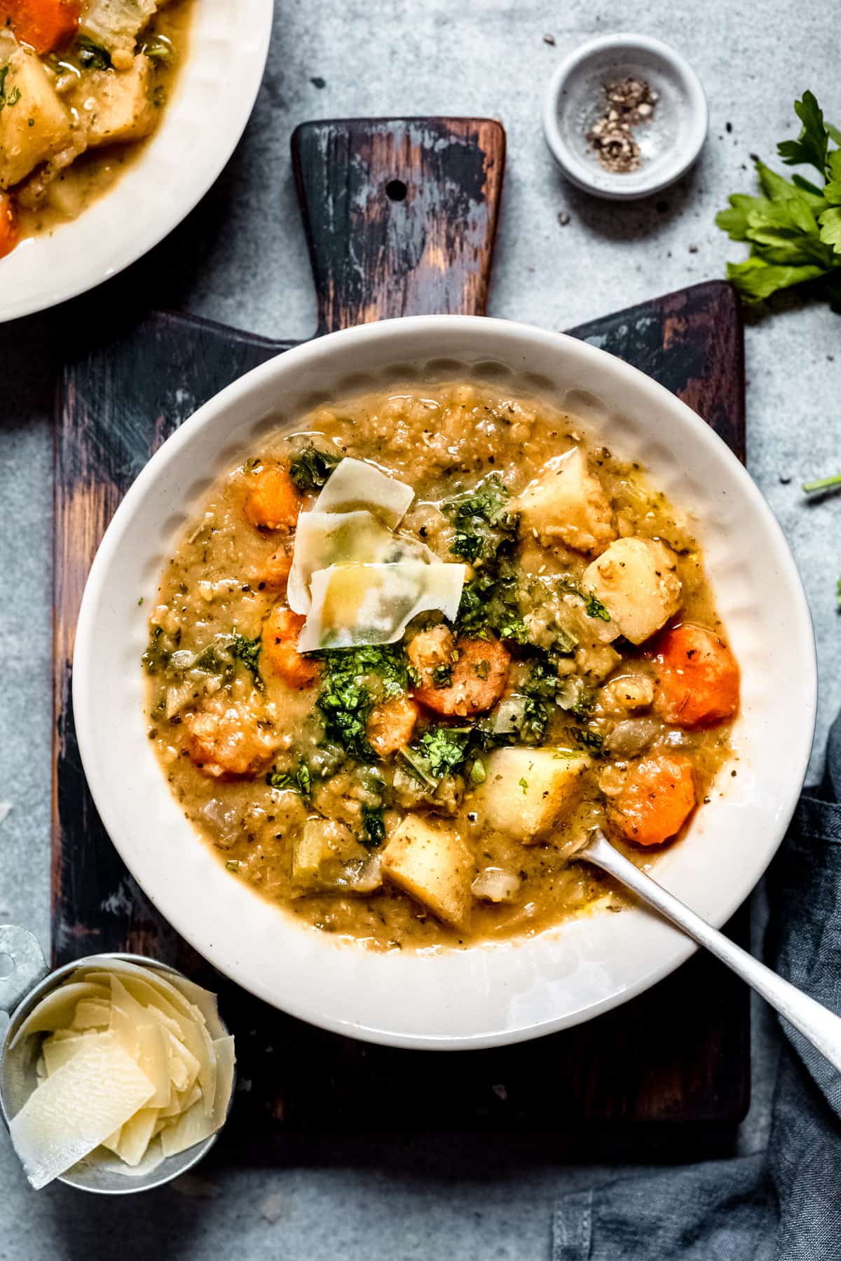 Slow cooker lentil soup in a white bowl.