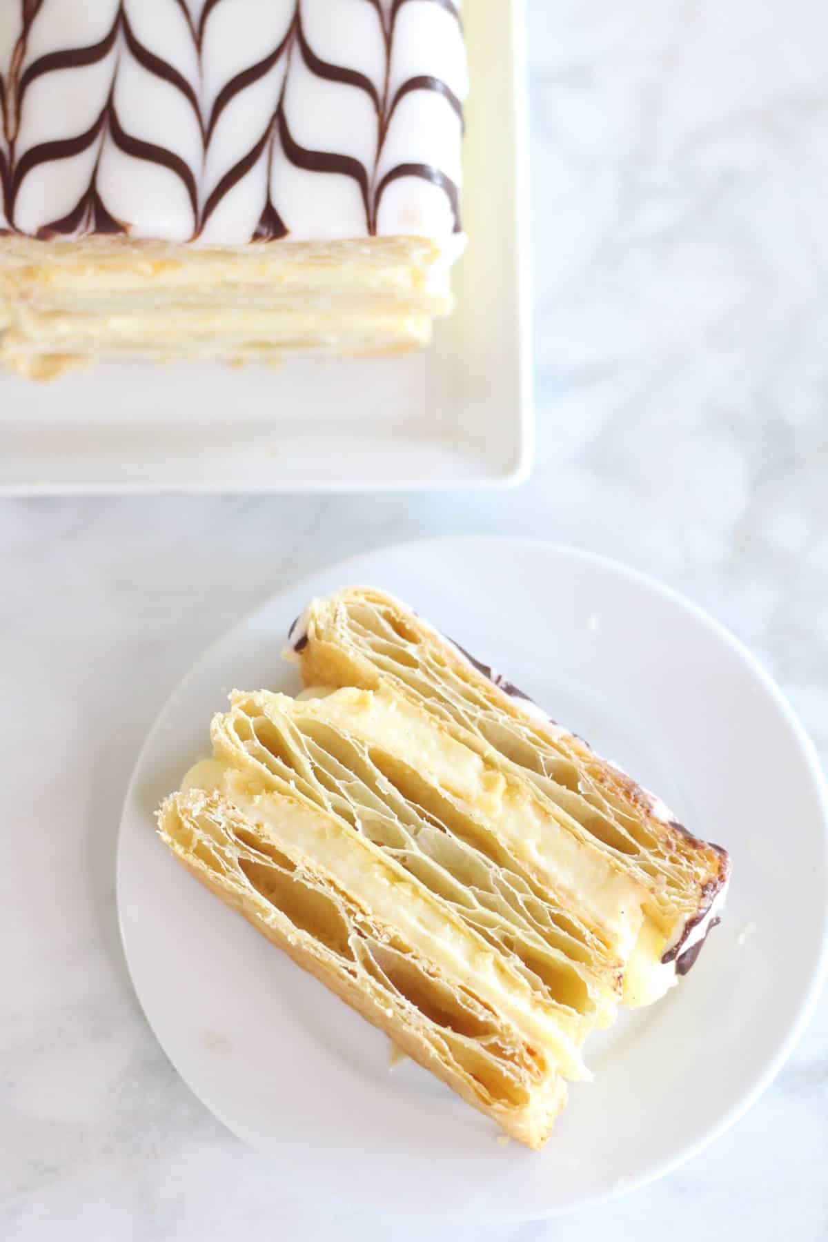 Piece of a French Napoleon pastry recipe on a white plate.