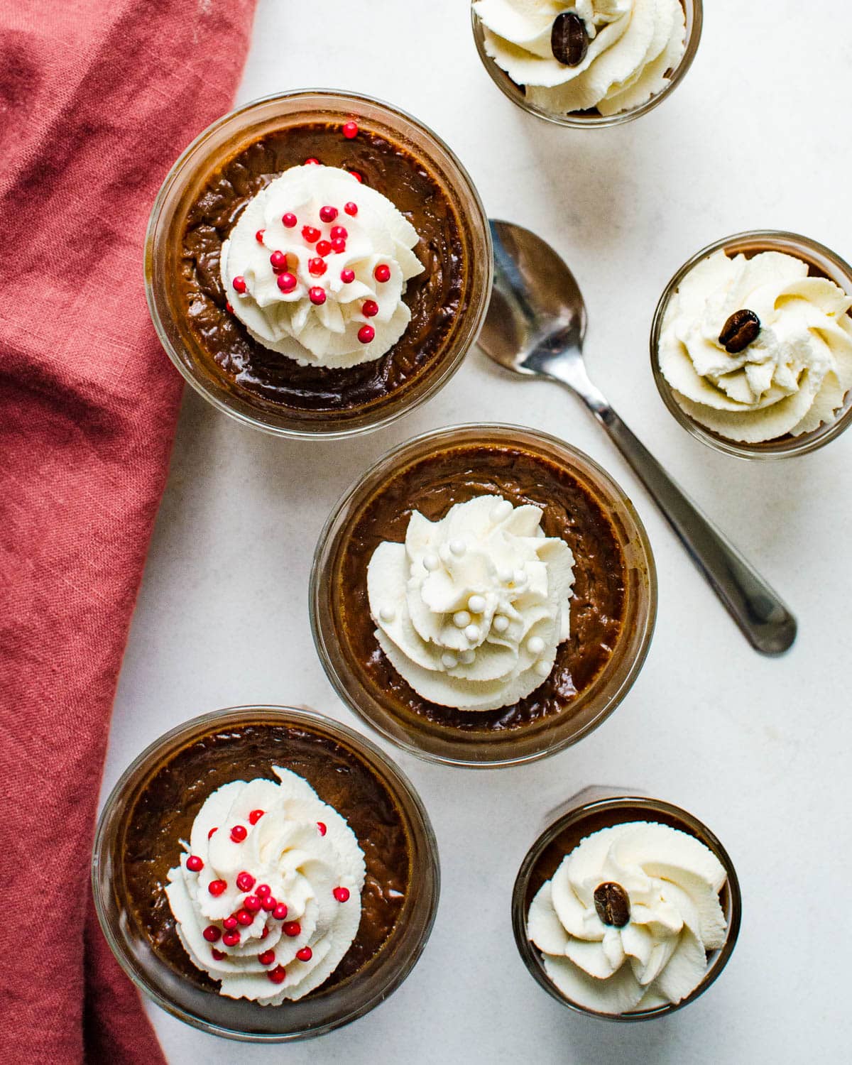 Chocolate pots de creme with various toppings.