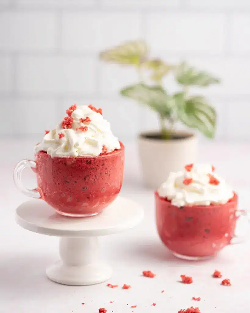 Red velvet mug cake in a clear mug.