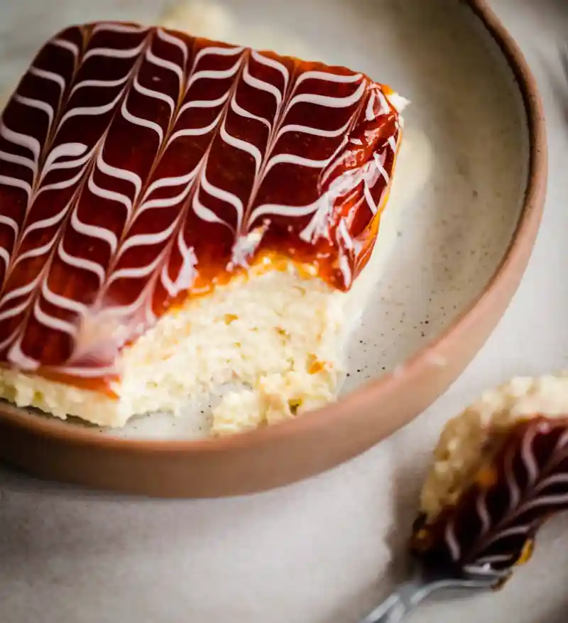 Trilece cake serving on a rimmed plate.