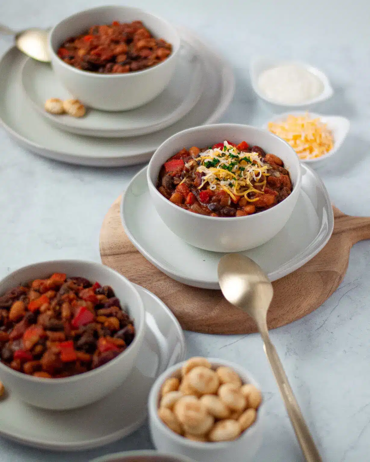 Vegetarian three bean chili in a bowl on a saucer.