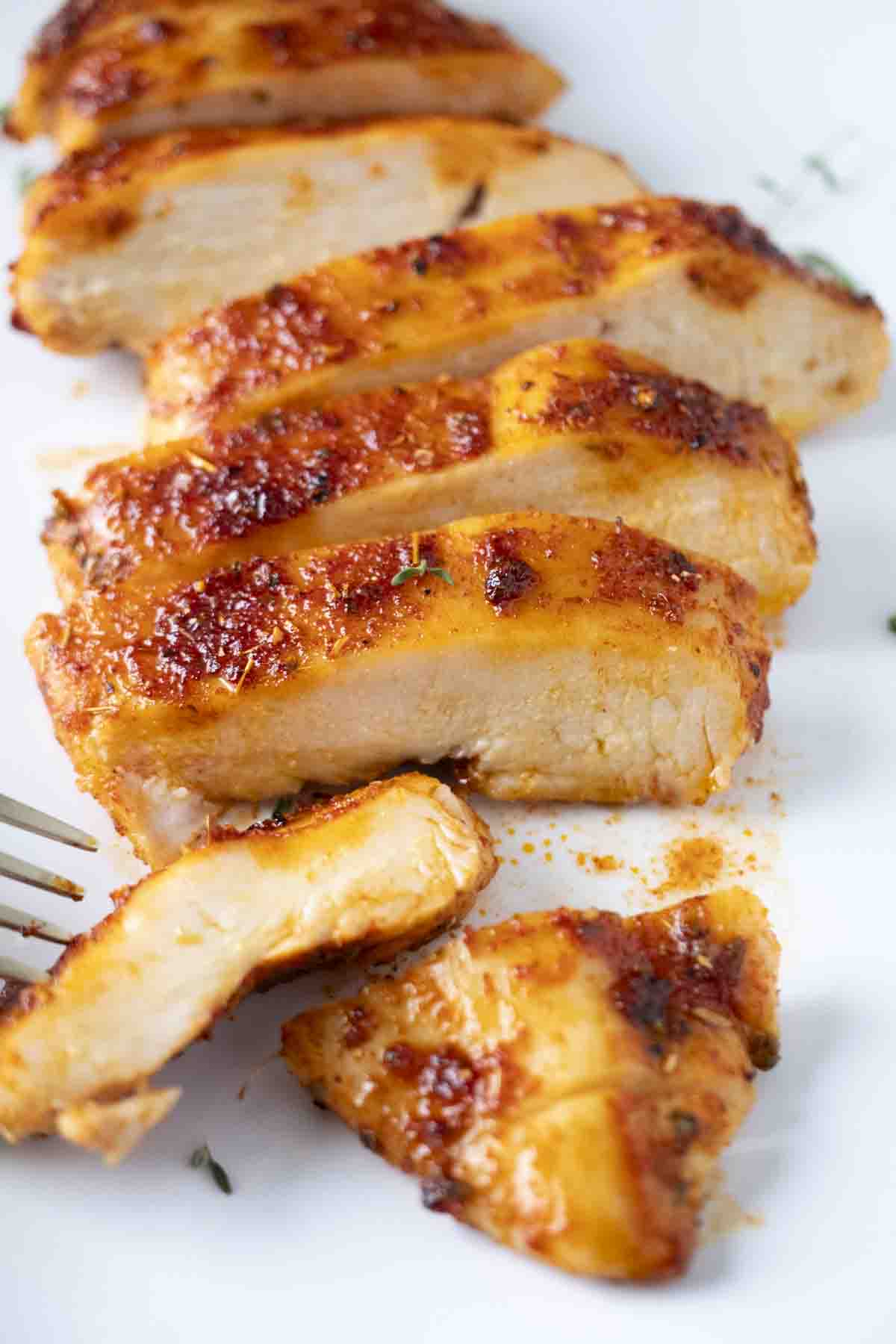 Up close shot of sliced seasoned air fryer chicken breast.