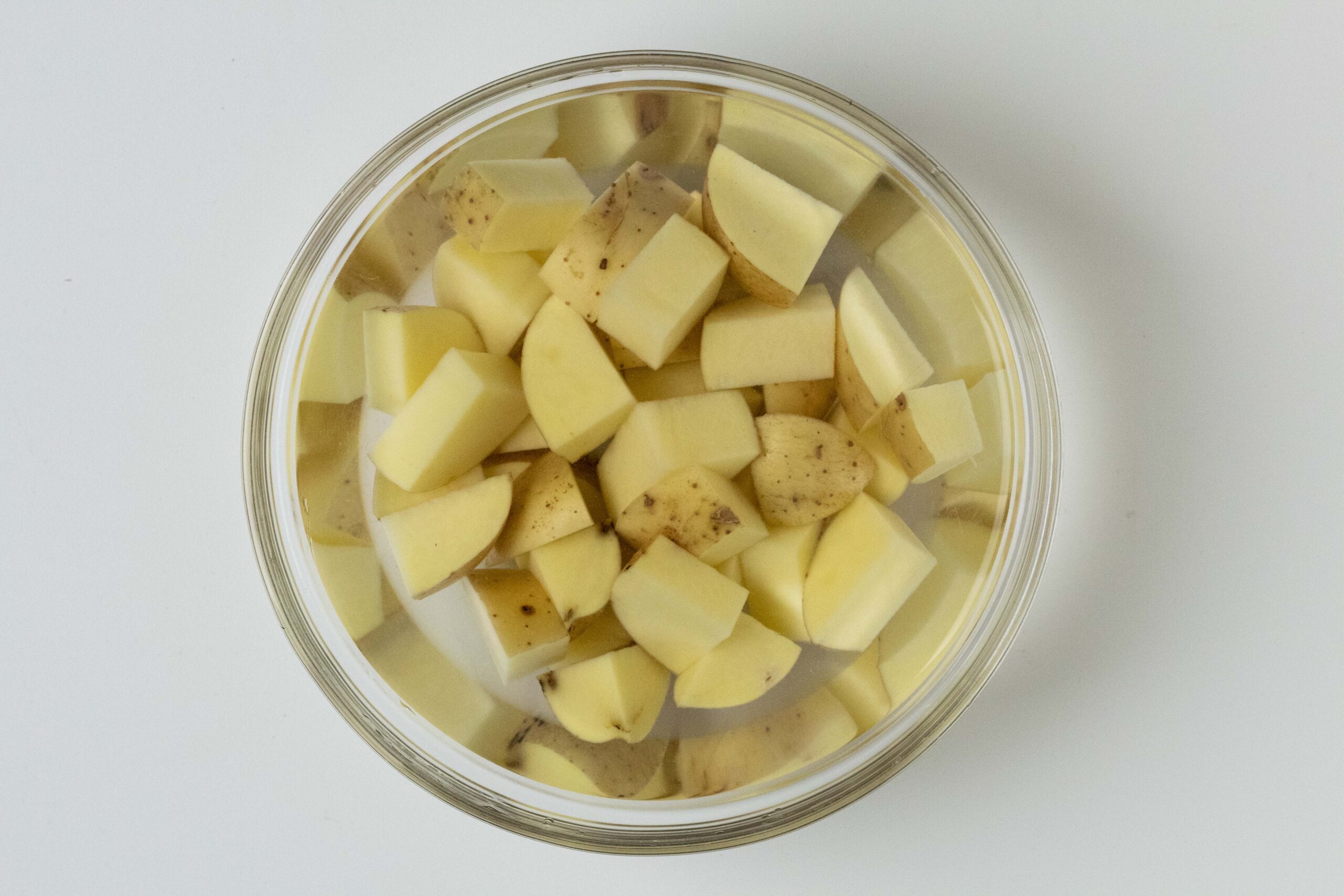 Diced potatoes in clear water.