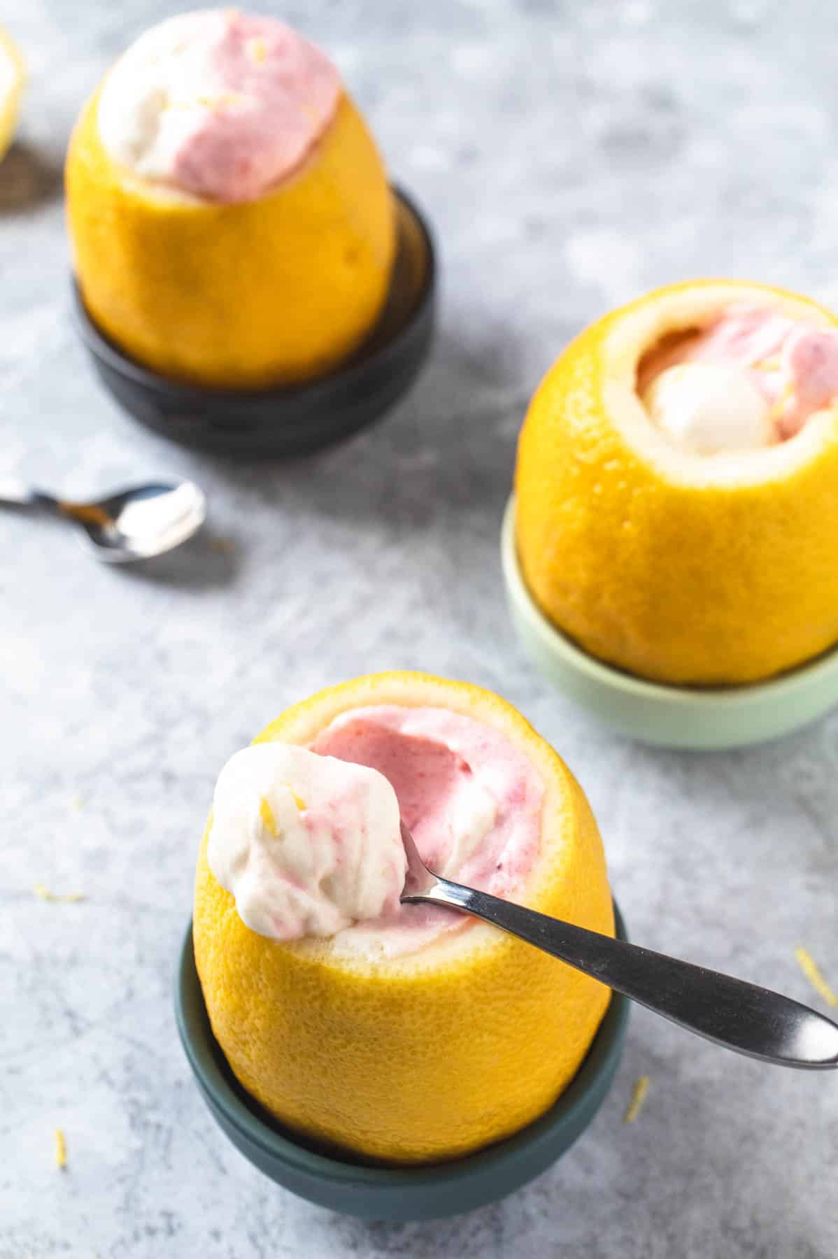 Strawberry lemon mousse in hollowed out lemons.