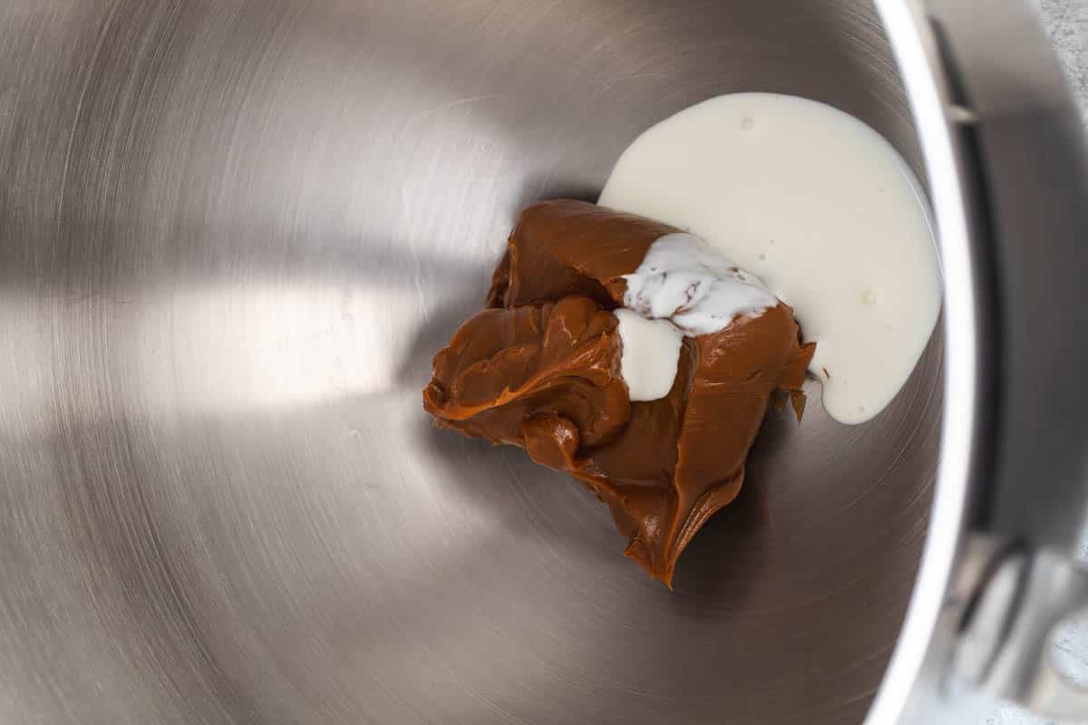 Caramel and heavy cream in a mixing bowl.