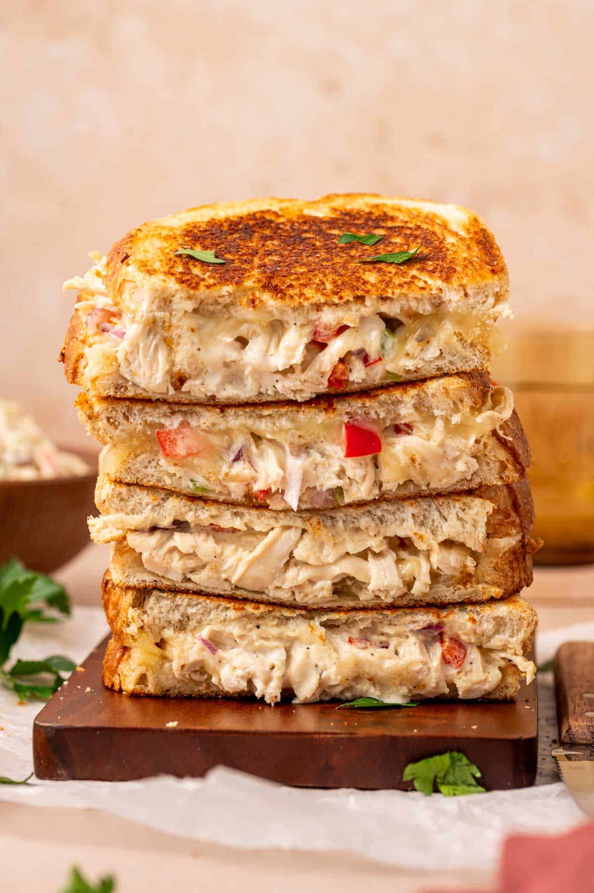 Stacked grilled sandwiches filled with warm, creamy shredded chicken salad.