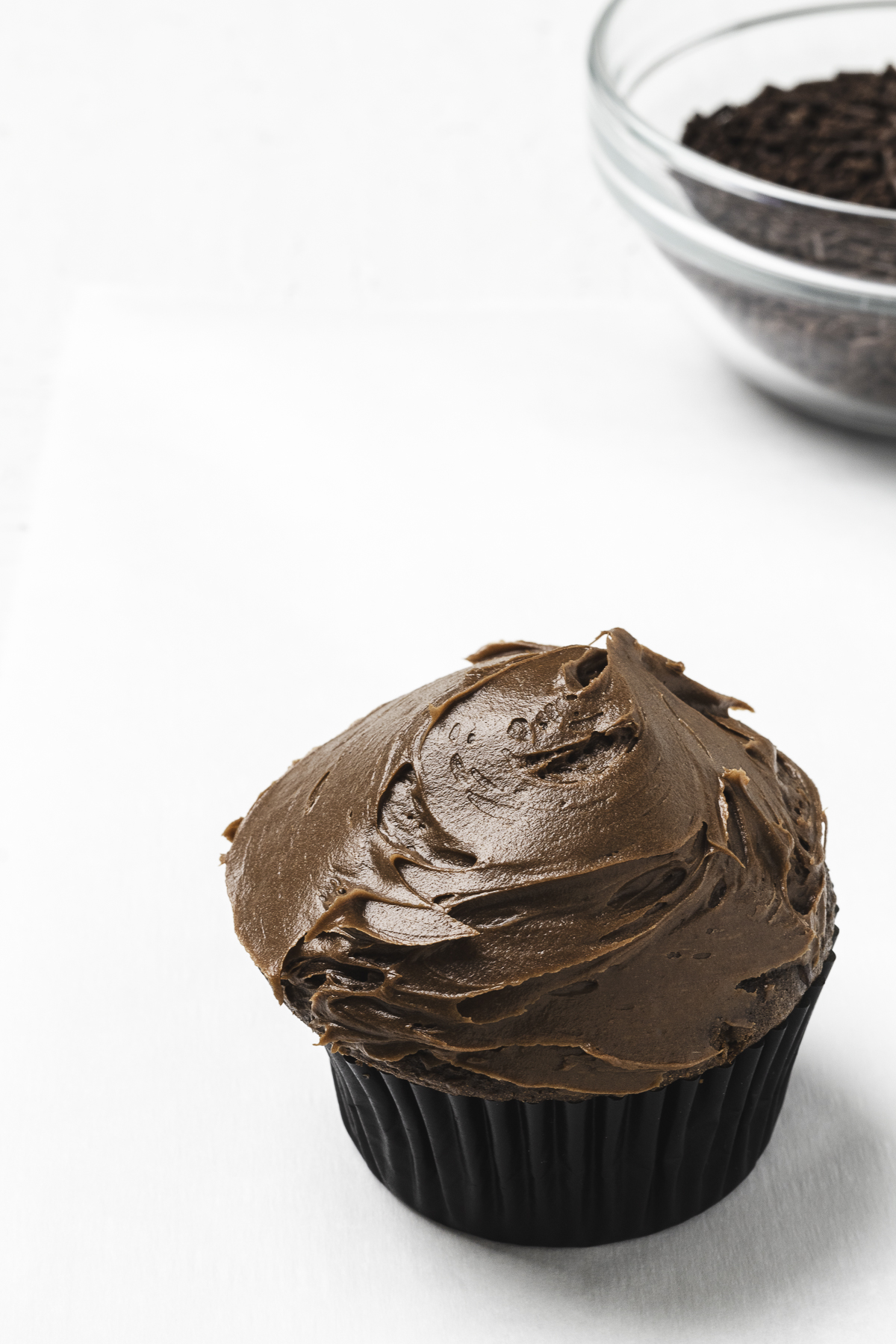 Chocolate cupcake with chocolate frosting.