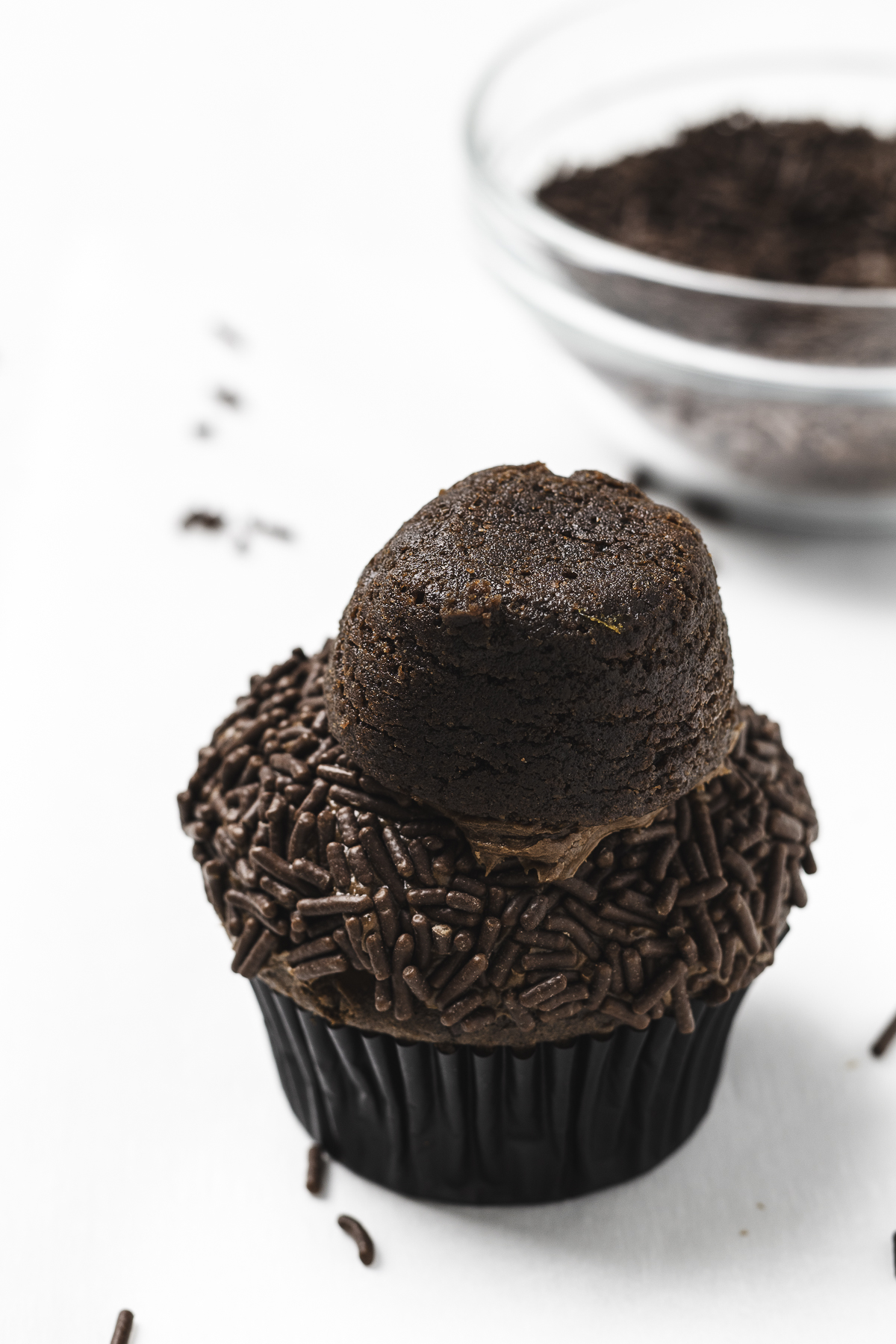 Brownie bite on top of chocolate cupcake.