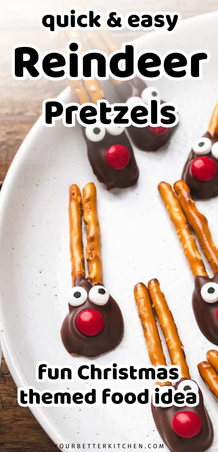 Pin image with plate of chocolate-dipped reindeer pretzels with candy eyes and red candy noses for Christmas.