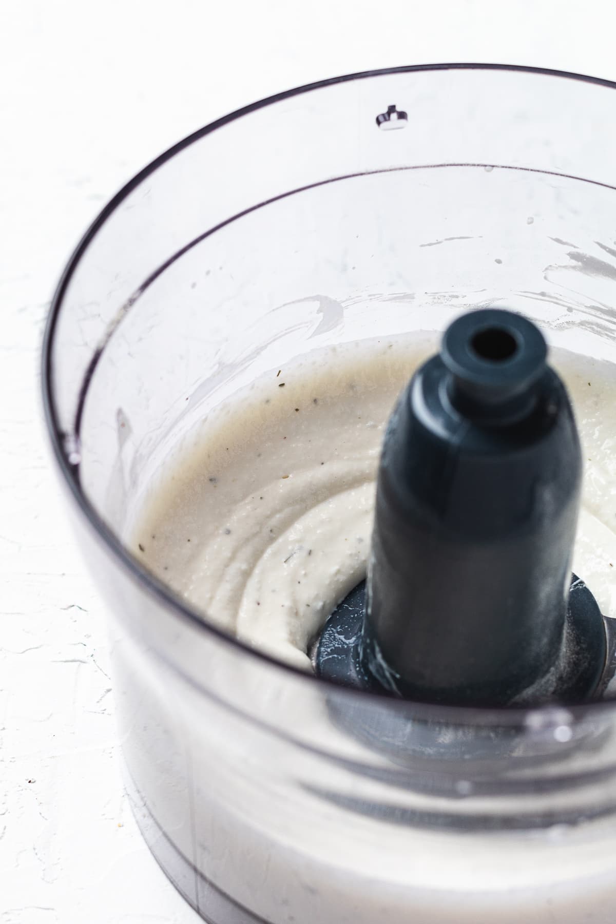 Smooth cottage cheese mixture blended in a food processor for the dip base.