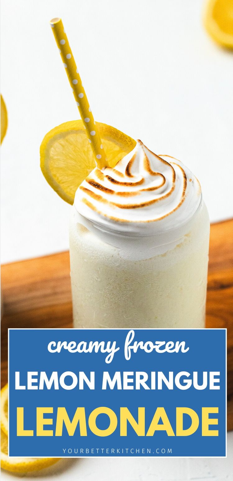 Glass of creamy frozen lemonade topped with toasted meringue, lemon slice, and straw with text โCreamy Frozen Lemon Meringue Lemonadeโ