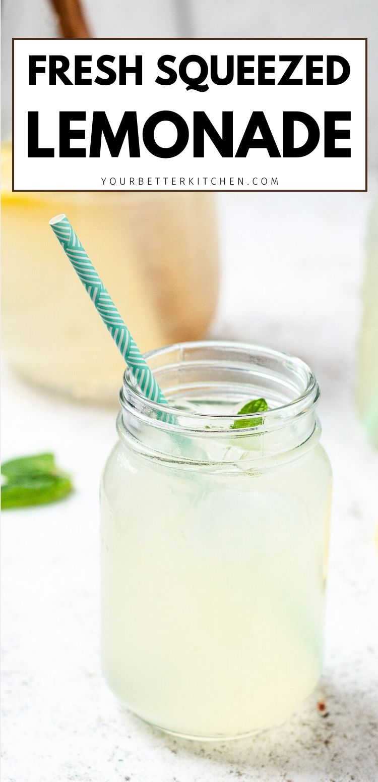 Mason jar of fresh squeezed lemonade with ice and straw, pin text reads fresh squeezed lemonade.