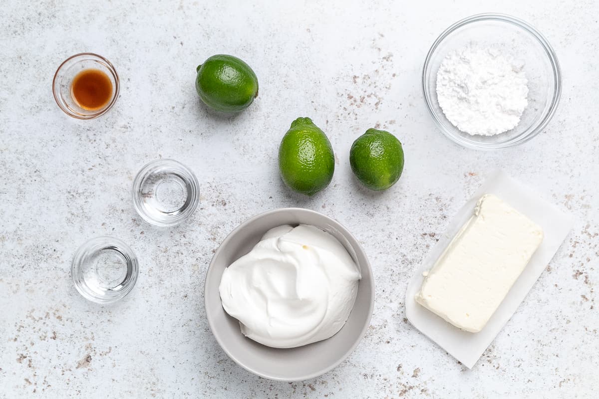 Margarita dip ingredients including cream cheese, limes, and sugar.