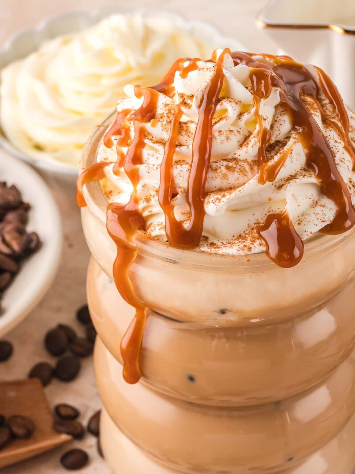 Tres leches iced latte topped with caramel drizzle.