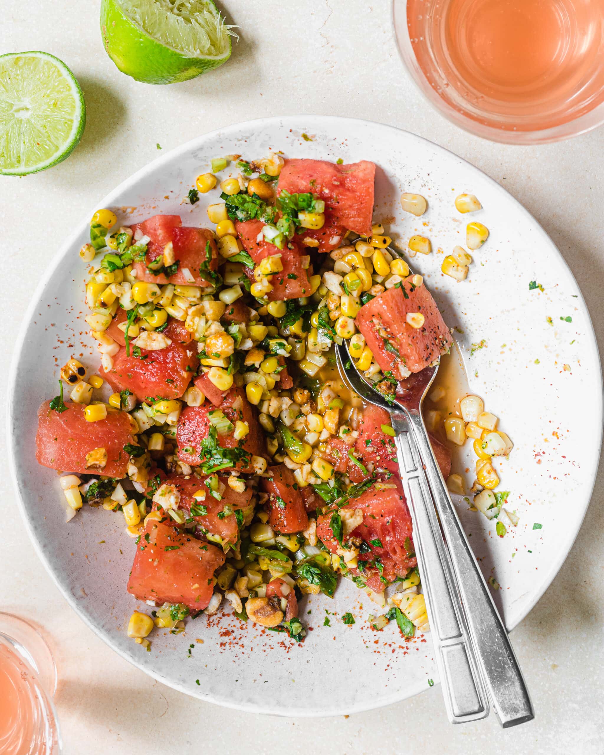 Watermelon corn salad with fresh herbs, lime, and charred corn.