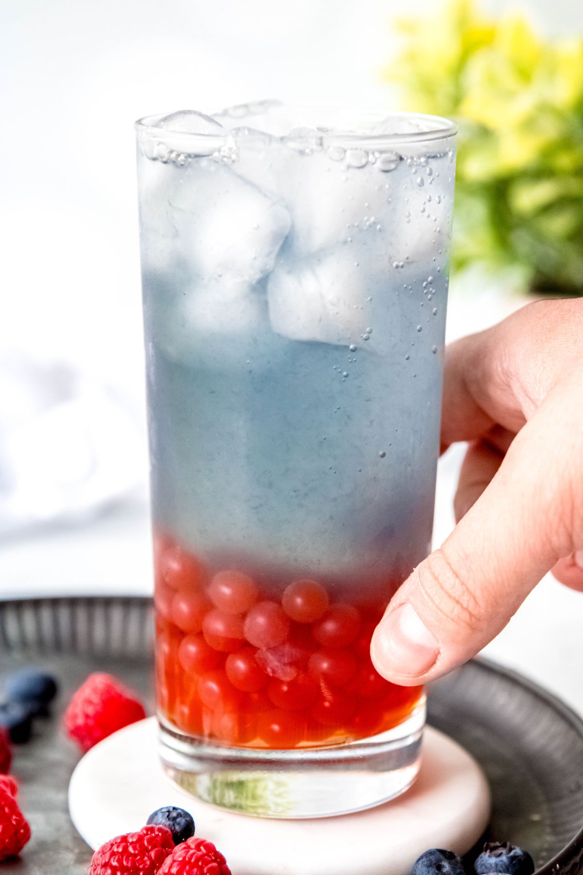 Summer berry refresher drink with ice and boba.